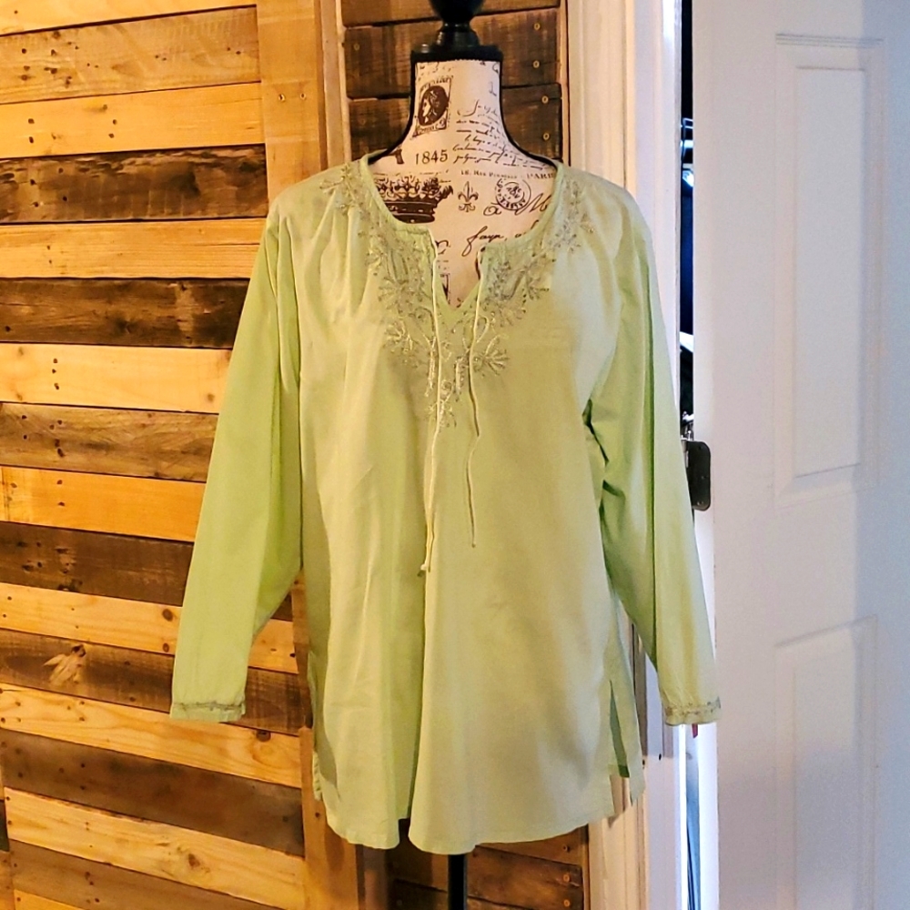 DCC woman's light green tunic with embroidery on chest and neckline and at wrist